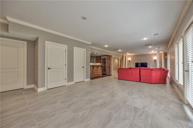 14606 Granada Rd, Leawood, KS 66224 - living area with ornamental molding, baseboards, recessed lighting, and ornate columns