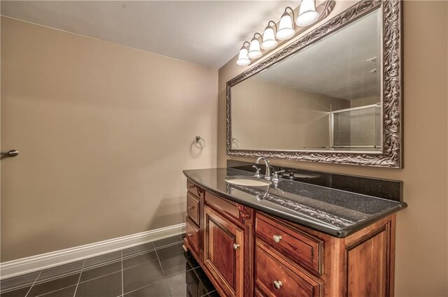 14606 Granada Rd, Leawood, KS 66224 - full bath featuring vanity, baseboards, and tile patterned flooring