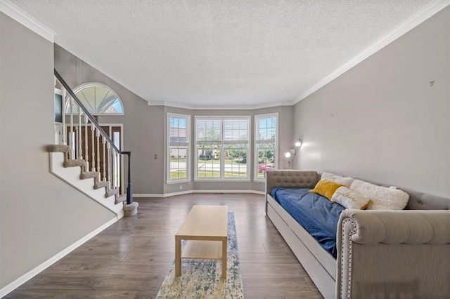 12890 S Greenwood St, Olathe, KS 66062 - living room featuring a textured ceiling, crown molding, dark wood-style floors, baseboards, and stairs