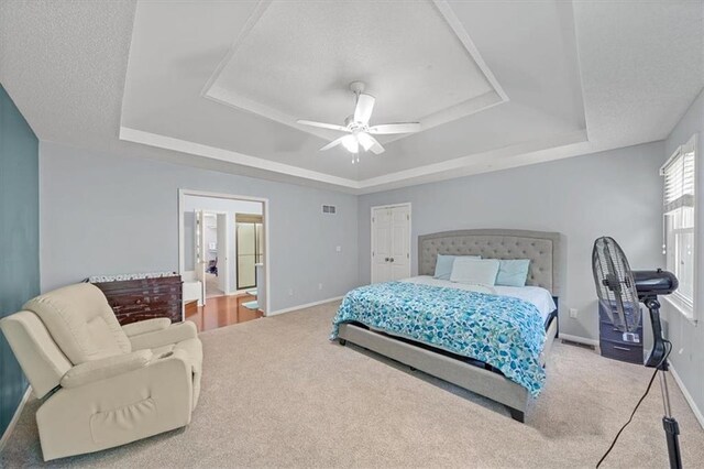 12890 S Greenwood St, Olathe, KS 66062 - bedroom featuring a tray ceiling, carpet flooring, and baseboards