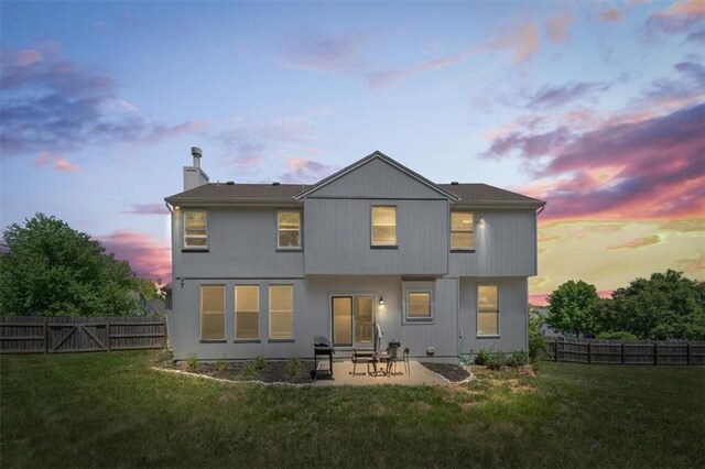 12890 S Greenwood St, Olathe, KS 66062 - rear view of property featuring a chimney and a patio