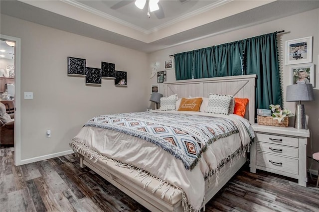 1609 Bluestem Dr, Ottawa, KS 66067 - bedroom with ornamental molding, dark wood-style flooring, baseboards, and a ceiling fan