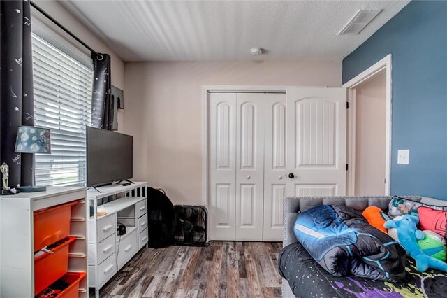 1609 Bluestem Dr, Ottawa, KS 66067 - bedroom featuring a closet and wood finished floors