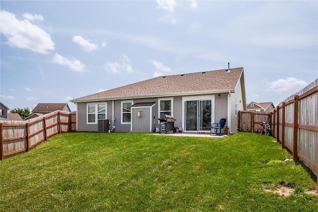 1609 Bluestem Dr, Ottawa, KS 66067 - rear view of property with central AC and a patio area