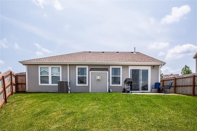 1609 Bluestem Dr, Ottawa, KS 66067 - back of house featuring central AC, a patio, and a shingled roof