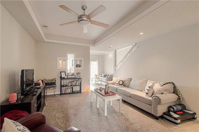 217 N 6th Ter, Louisburg, KS 66053 - living area with carpet flooring, a ceiling fan, a raised ceiling, and baseboards