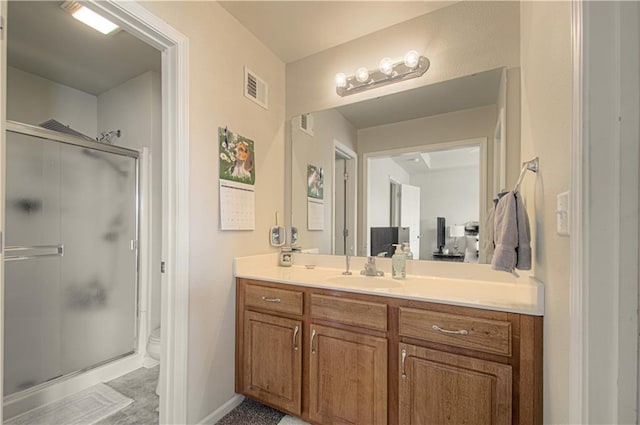 217 N 6th Ter, Louisburg, KS 66053 - full bathroom with vanity, a stall shower, toilet, and baseboards