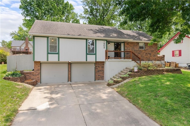 1805 N Lazy Branch Rd, Independence, MO 64058 - view of front of property featuring brick siding, a garage, concrete driveway, and a front yard