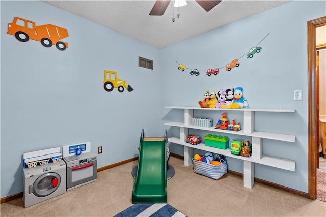 1805 N Lazy Branch Rd, Independence, MO 64058 - recreation room with carpet flooring, a ceiling fan, baseboards, and a textured ceiling