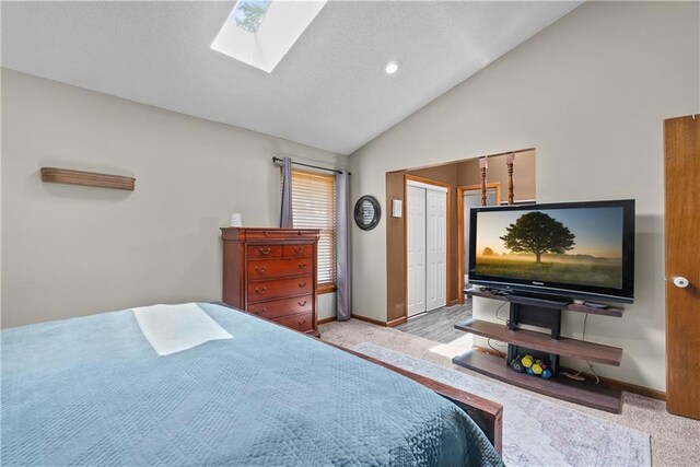 1805 N Lazy Branch Rd, Independence, MO 64058 - bedroom with carpet flooring, lofted ceiling, a skylight, baseboards, and recessed lighting