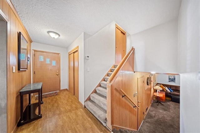 1107 E 110th St, Kansas City, MO 64131 - foyer entrance featuring light wood-style flooring and stairs