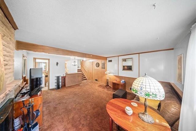 1107 E 110th St, Kansas City, MO 64131 - carpeted living room featuring stairs, a textured ceiling, and baseboards