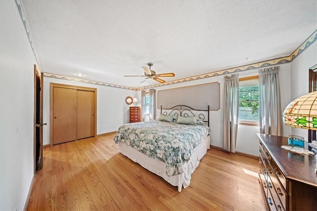 1107 E 110th St, Kansas City, MO 64131 - bedroom featuring light wood finished floors, a textured ceiling, ornamental molding, baseboards, and ceiling fan