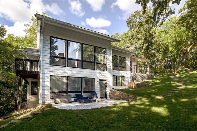 12204 Catalina St, Leawood, KS 66209 - back of house featuring a yard and a patio area