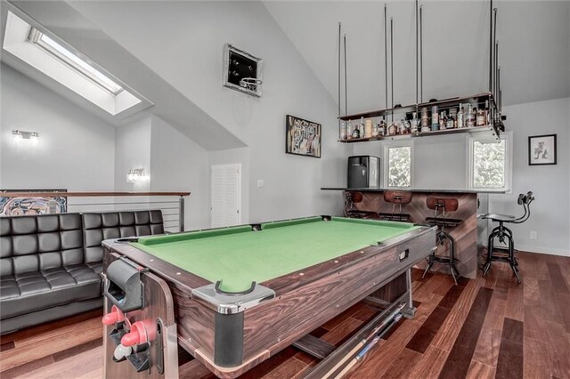 12204 Catalina St, Leawood, KS 66209 - recreation room featuring vaulted ceiling, a skylight, wood finished floors, and billiards table