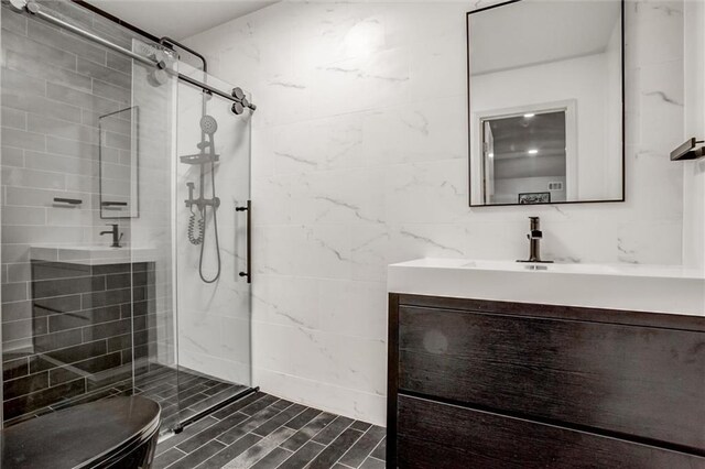 12204 Catalina St, Leawood, KS 66209 - full bathroom with a tile shower, vanity, and tile walls