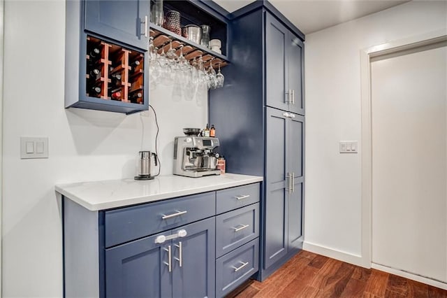 12204 Catalina St, Leawood, KS 66209 - indoor dry bar with dark wood-style flooring and baseboards