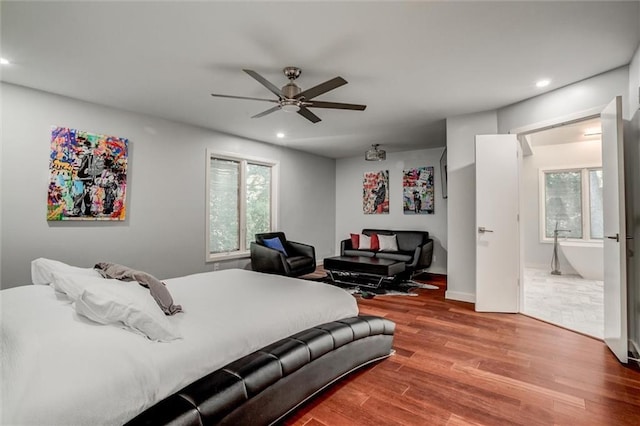 12204 Catalina St, Leawood, KS 66209 - bedroom featuring wood finished floors, recessed lighting, multiple windows, and ceiling fan