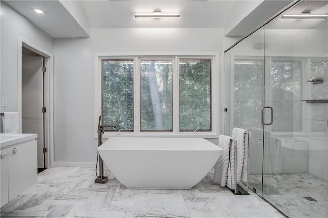 12204 Catalina St, Leawood, KS 66209 - bathroom featuring a freestanding tub, vanity, and a shower stall