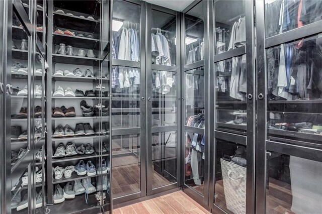 12204 Catalina St, Leawood, KS 66209 - spacious closet with light wood-style floors