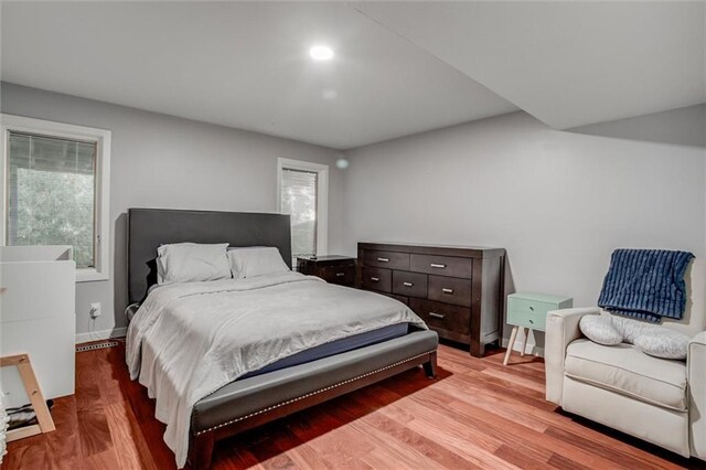 12204 Catalina St, Leawood, KS 66209 - bedroom with light wood-style flooring and baseboards