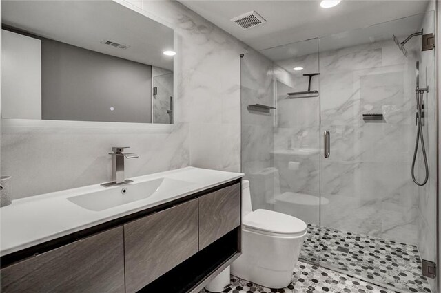 12204 Catalina St, Leawood, KS 66209 - bathroom featuring vanity, a stall shower, and recessed lighting