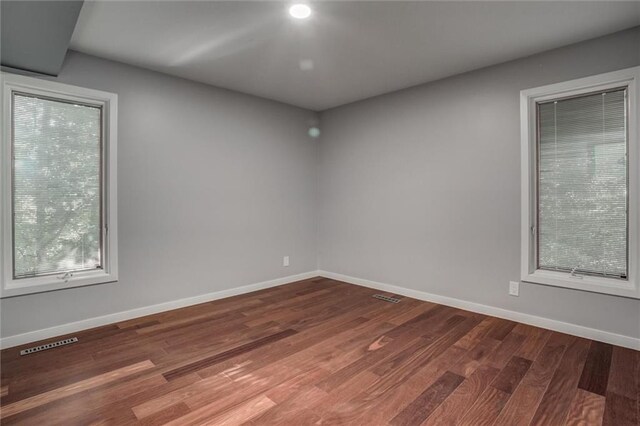 12204 Catalina St, Leawood, KS 66209 - empty room featuring baseboards and wood finished floors