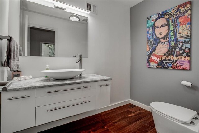 12204 Catalina St, Leawood, KS 66209 - half bathroom with wood finished floors and vanity