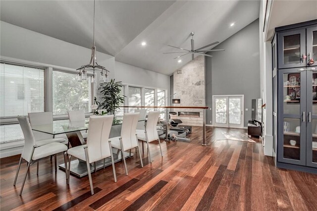 12204 Catalina St, Leawood, KS 66209 - dining room with high vaulted ceiling, dark wood-style floors, healthy amount of natural light, a ceiling fan, and recessed lighting