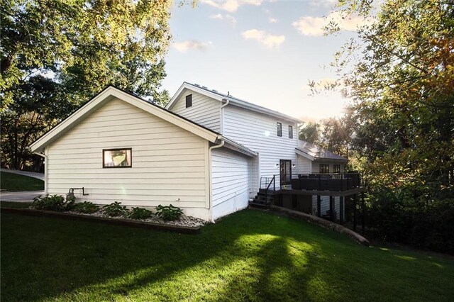 12204 Catalina St, Leawood, KS 66209 - view of home's exterior with a yard and a wooden deck