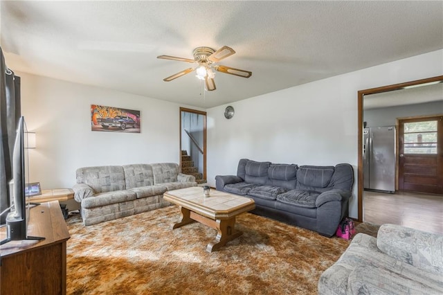 711 S Colby St, Hamilton, MO 64644 - living area featuring a ceiling fan, stairs, and wood finished floors