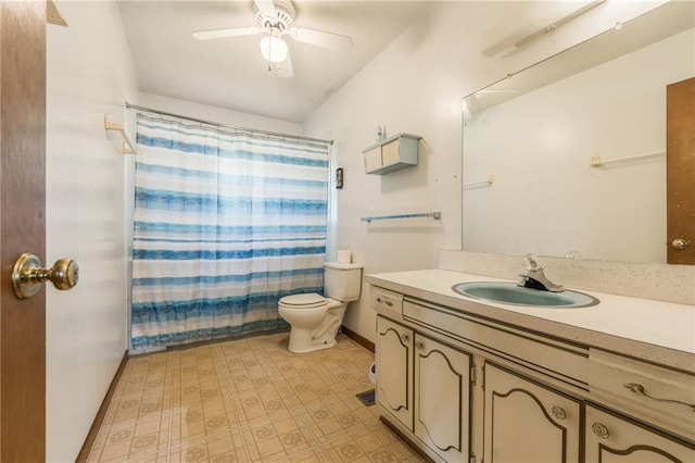 711 S Colby St, Hamilton, MO 64644 - bathroom featuring vanity, toilet, baseboards, ceiling fan, and tile patterned floors