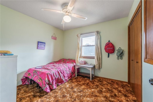 711 S Colby St, Hamilton, MO 64644 - bedroom featuring carpet floors, a closet, a ceiling fan, a textured ceiling, and baseboards