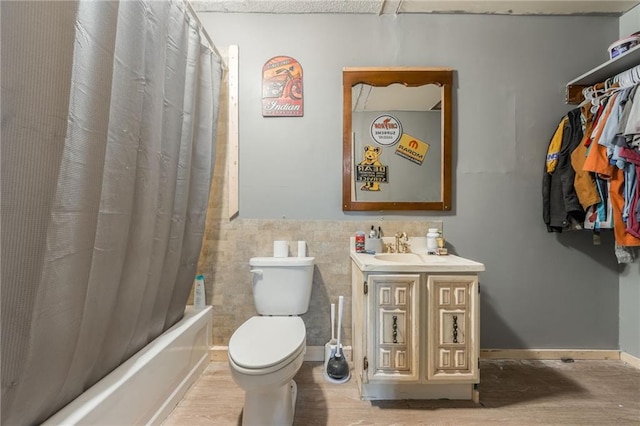 711 S Colby St, Hamilton, MO 64644 - bathroom with vanity, toilet, shower / bath combo with shower curtain, and tile walls