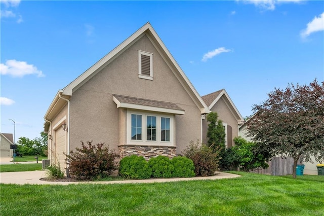 20740 W 224th St, Spring Hill, KS 66083 - view of front of property featuring stucco siding, a garage, and stone siding