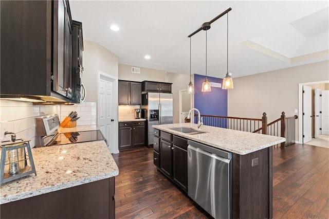 20740 W 224th St, Spring Hill, KS 66083 - kitchen with stainless steel appliances, dark wood finished floors, backsplash, an island with sink, and recessed lighting
