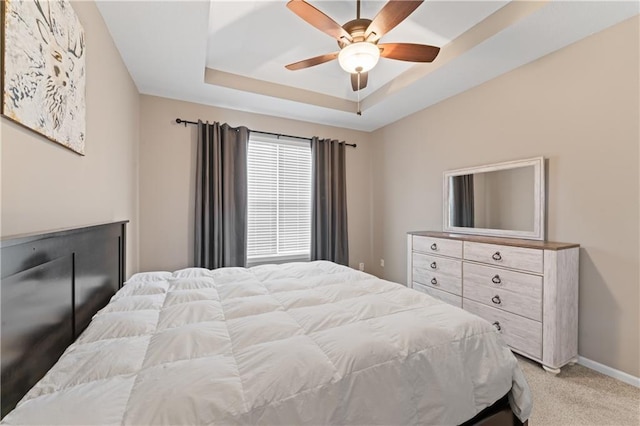 20740 W 224th St, Spring Hill, KS 66083 - bedroom featuring light carpet, a tray ceiling, and a ceiling fan