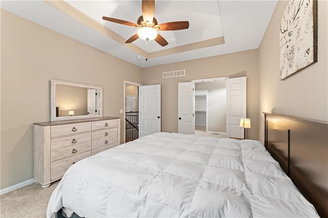 20740 W 224th St, Spring Hill, KS 66083 - bedroom with a raised ceiling, light colored carpet, ceiling fan, and a spacious closet