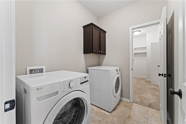20740 W 224th St, Spring Hill, KS 66083 - washroom with washer and dryer, light colored carpet, and cabinet space
