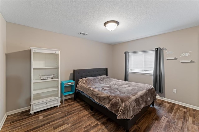 20740 W 224th St, Spring Hill, KS 66083 - bedroom with dark wood finished floors and a textured ceiling