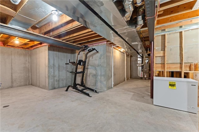 20740 W 224th St, Spring Hill, KS 66083 - unfinished below grade area featuring fridge and heating unit