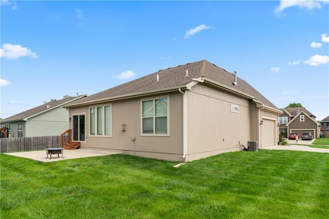 20740 W 224th St, Spring Hill, KS 66083 - back of property featuring entry steps, an attached garage, driveway, and a patio area