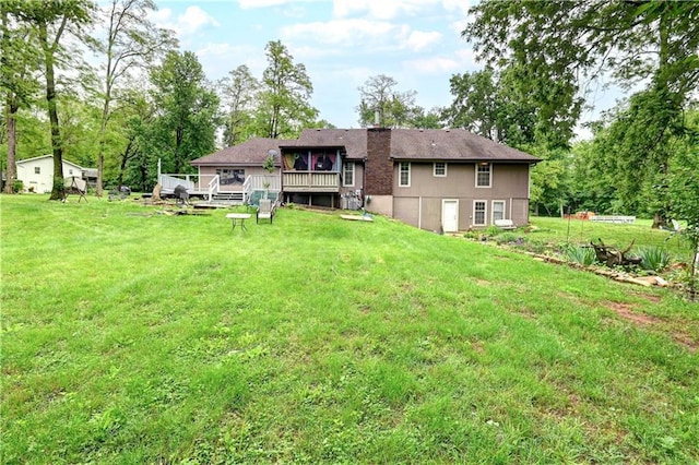 19490 Countryside Cir, Weston, MO 64098 - back of house with a deck, a yard, a chimney, and view of scattered trees