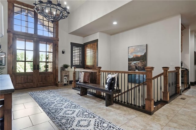 11106 W 146th Ter, Overland Park, KS 66221 - entryway featuring french doors, a chandelier, a towering ceiling, tile patterned flooring, and recessed lighting