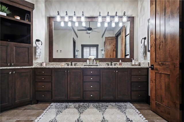 11106 W 146th Ter, Overland Park, KS 66221 - bathroom featuring double vanity and a ceiling fan