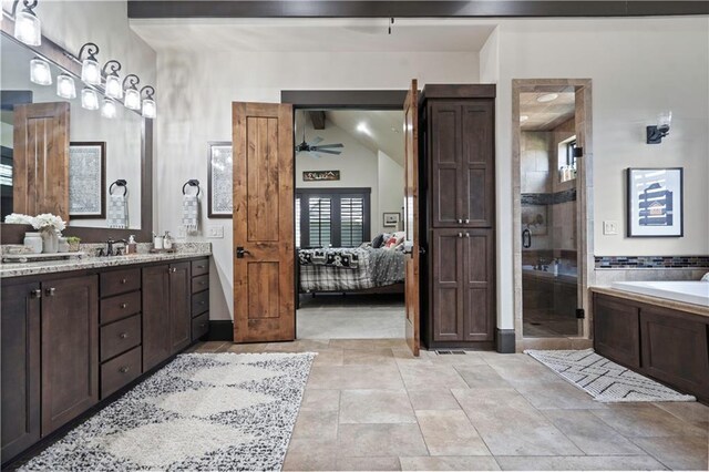 11106 W 146th Ter, Overland Park, KS 66221 - ensuite bathroom with vanity, a shower stall, ceiling fan, a garden tub, and stone finish flooring