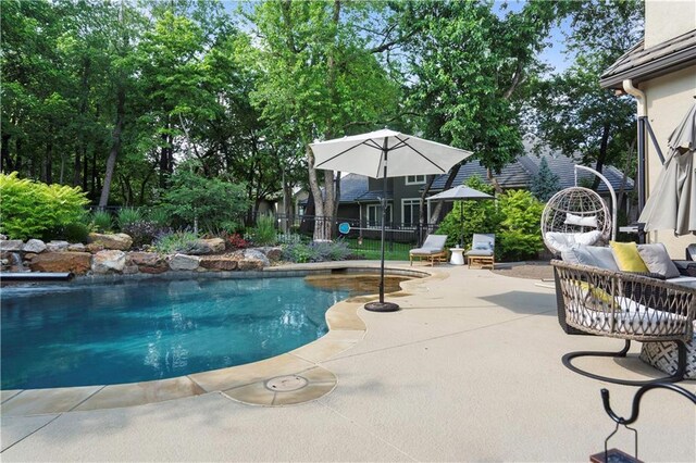 11106 W 146th Ter, Overland Park, KS 66221 - swimming pool featuring a patio