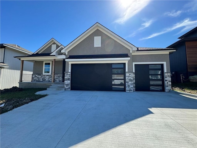 22415 87th Ter, Lenexa, KS 66227 - view of front facade featuring stone siding, stucco siding, and a garage