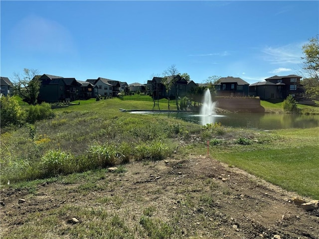 22415 87th Ter, Lenexa, KS 66227 - view of green lawn with a residential view and a water view