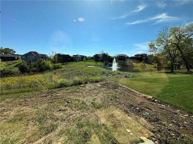 22415 87th Ter, Lenexa, KS 66227 - view of grassy yard with a water view and a residential view